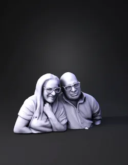 two adults sitting side by side with blurred faces in a casual setting