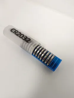 CR2032 battery compact holder with magnet lock