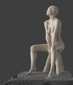 Decorative Filigree Sculpture of a Woman Sitting On a Stool