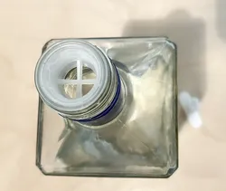 Liquor bottle flow restrictor puller tool