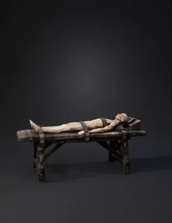 wooden torture rack with bound humanoid figure on weathered planks me
