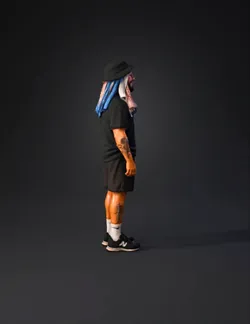 side view tattooed person in black athletic outfit with blue scarf wra