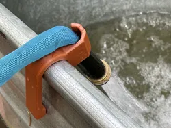 Stock tank hose holder