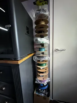 Modular wall-mounted vertical filament roll holder