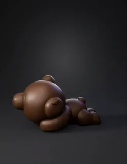 brown teddy bear clay sculpture lying on its side with smooth rounded