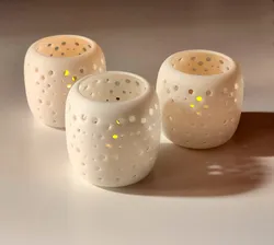 Simple and cute tea lights vases with holes