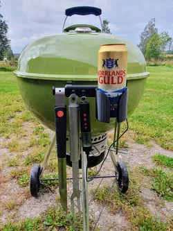 Handle with hooks, hangers and can holder for weber kettle grill.