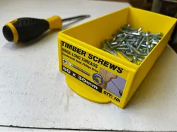 Fastener trays for packaged screws.