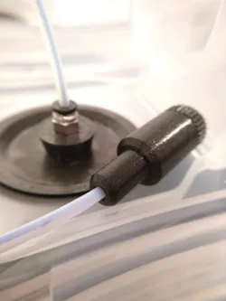 Filament feed tube end cap