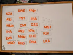 Magnetic Nametag / Acronym plate generator (openscad + bash script)