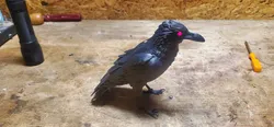 Preening Raven by Peter Farell with glowing red eye circuitry