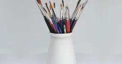Brushes, pens, screwdrivers, ..., holder vase