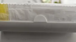 Trashbag holder with tear-off aid