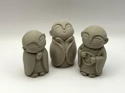 Three Monk Figurines