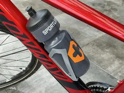 Elegant bottle holder for bike with hidden AirTag compartment