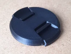 Camera lens lid with 3D printed springs