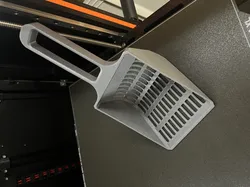 Cat litter scoop.