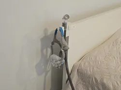 Headboard attachment for CPAP wall holder