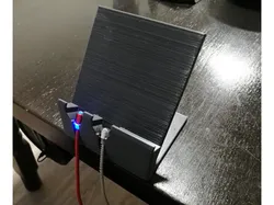 Phone desk stand with magnetic charge cable holder