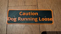 "Caution Dog Running Loose" sign