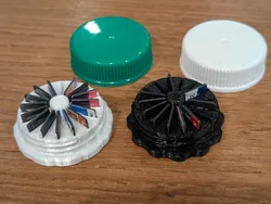Container for 16 MicroSD cards. (Upcycled Cider jug lids, optionally).