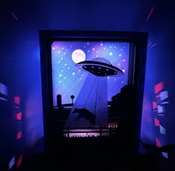 A mostly harmless abduction - A lightbox scene of an unwilling cow’s cosmic detour.