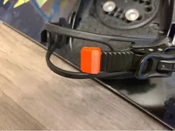 Snowboard toe strap fixer