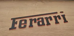 Ferrari text logo MMU