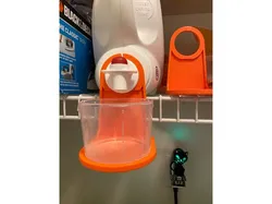 Laundry detergent measure cup hanging shelf
