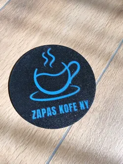 a coaster with the words "zapas kofeny" written on it