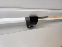 Hinge-Mounted Door Stopper