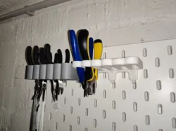 Skadis holder for nippers and scissors