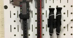 Caliper holder for pegboard