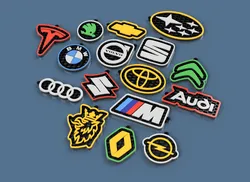 Honeycomb-style keychains with car brand logos. part1