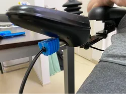 Socket holder for electric wheelchair charger