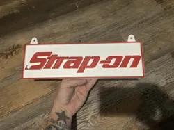 Strap-on parody sign