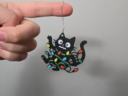 Cat tangled in Christmas lights