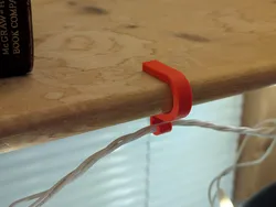 Shelf light clip - one or two strands