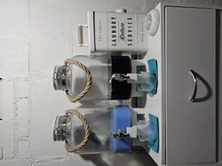 Glass container or liquid dispenser crossed base
