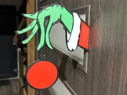Grinch hand with Christmas ball