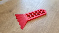 Scraper with wavy blade