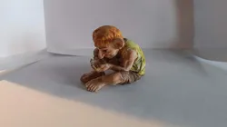 Goblin hiding something in his hands