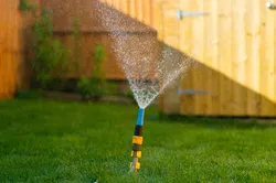 Turn your garden hose into a sprinkler