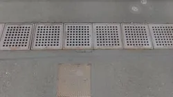 Manhole drainage grates