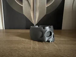 A skull-shaped ashtray with a dark, gothic look