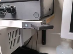 Hanger for Brymen BM235 EEVBlog Multimeter on the corner of a shelf for easy viewing