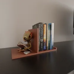 alien reading book book stand