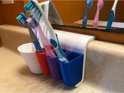Backsplash toothbrush holder