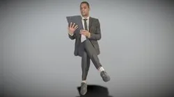 Businessman in suit reading documents 225
