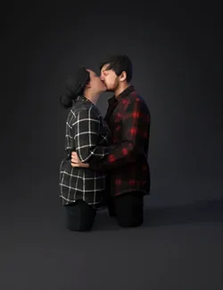 couple kissing with plaid shirts faces blurred
